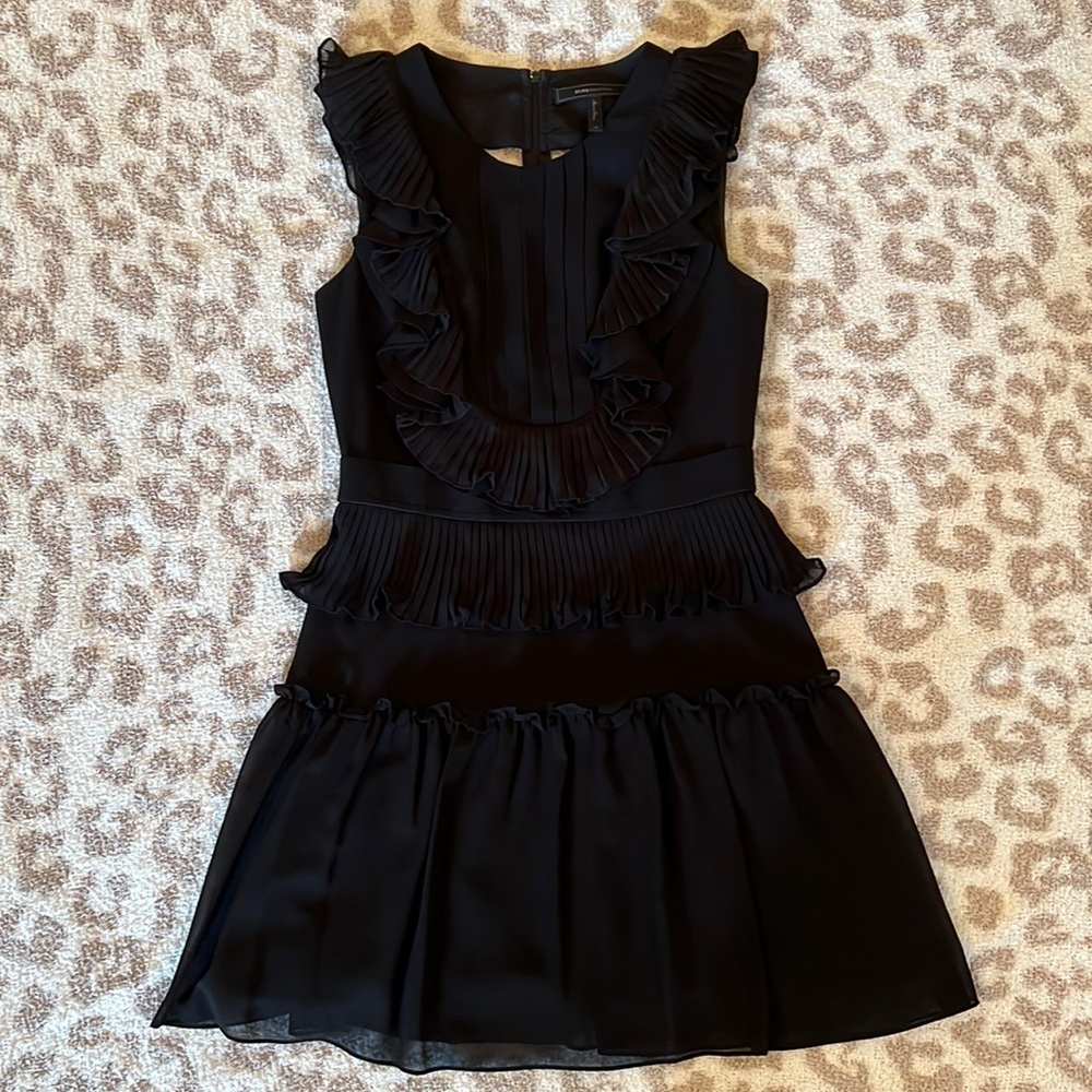 BCBG Maxazria. Black Dress. Ruffles. Cut Outs on Back. Size 4. Great Condition.